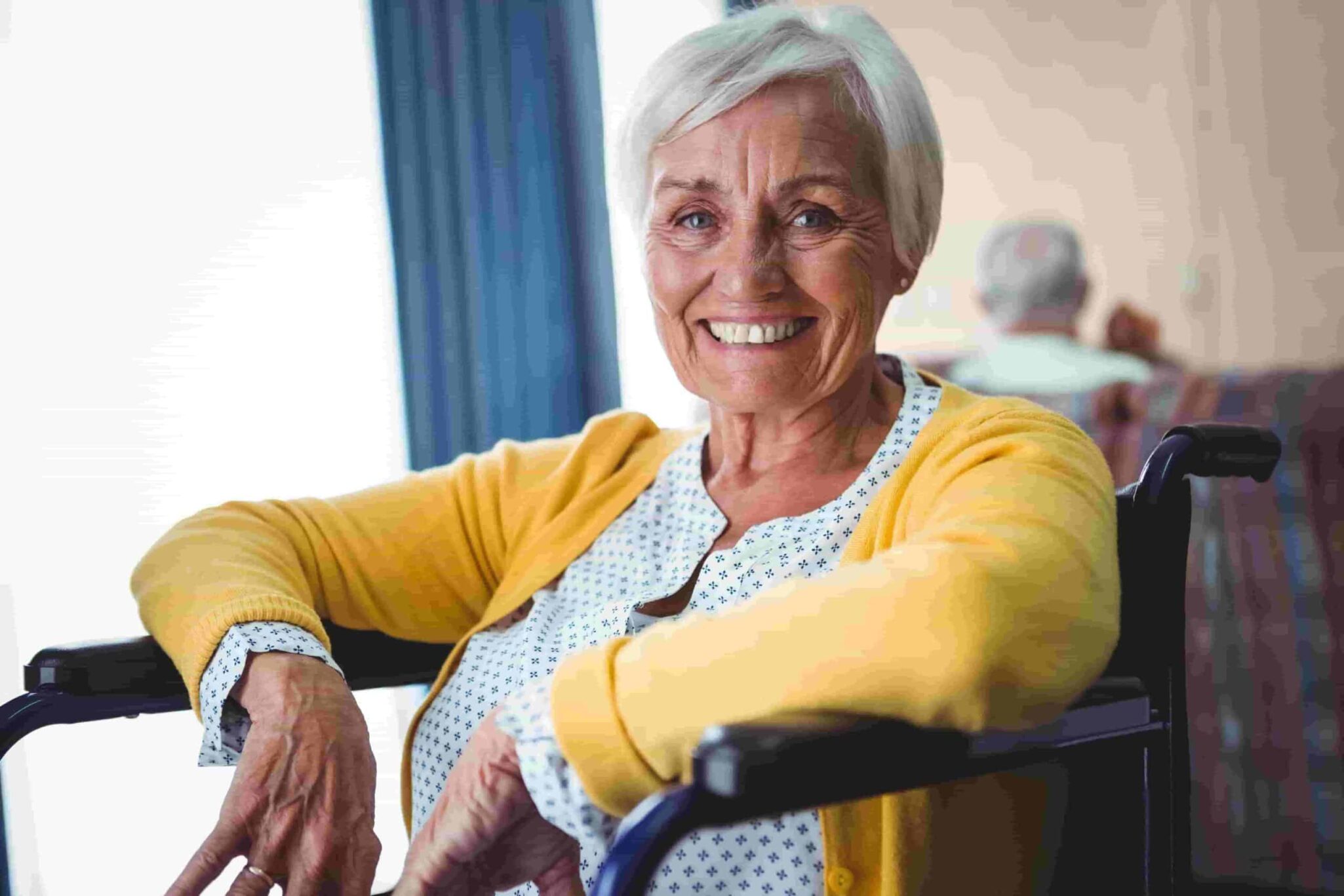 Elderly woman in wheelchair smiling Elderly woman in wheelchair smiling