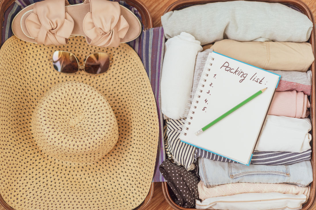 close up of a packed suitcase and packing list for the move to senior living