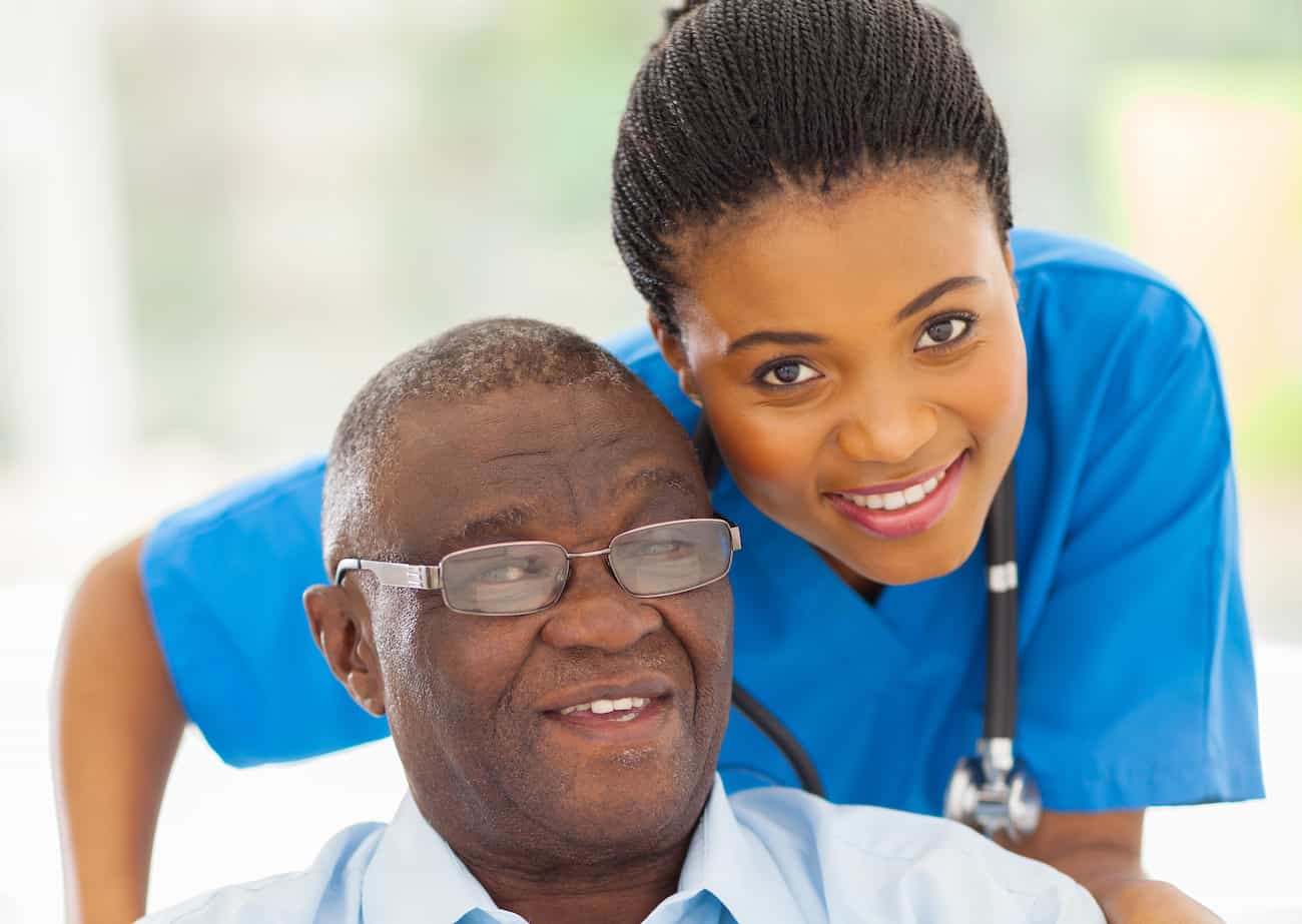 elderly african american man and caregiver